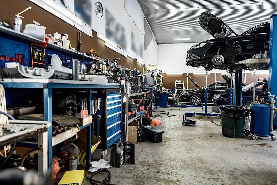 Car service centre with automobile repair tools used in a mechanical workshop
