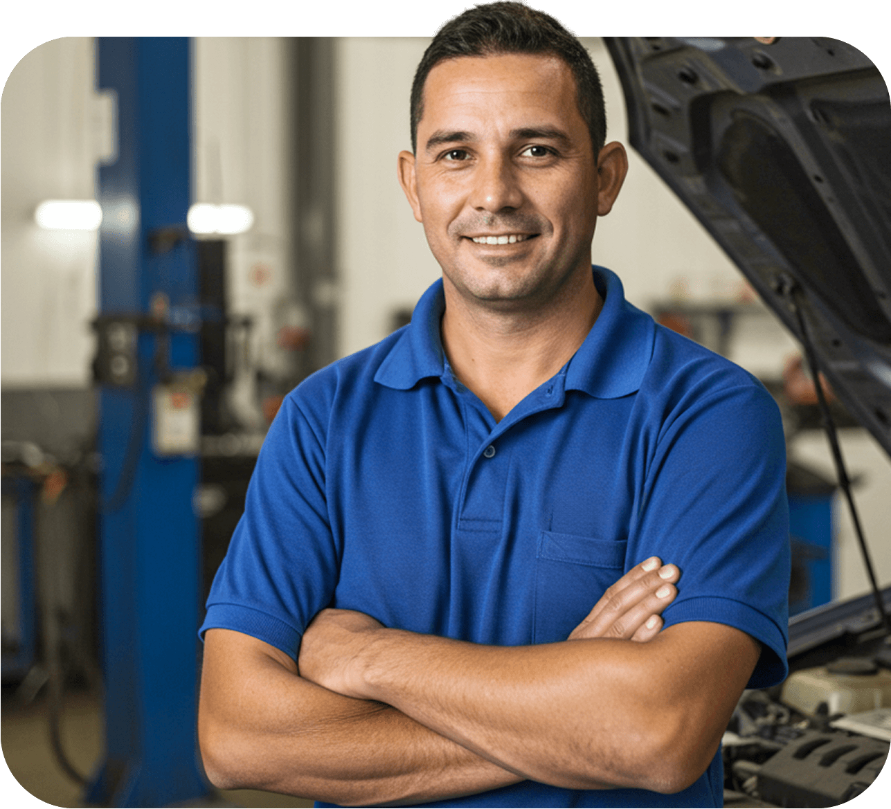 Mechanic standing confidently in front of a vehicle, using Workshop Software
